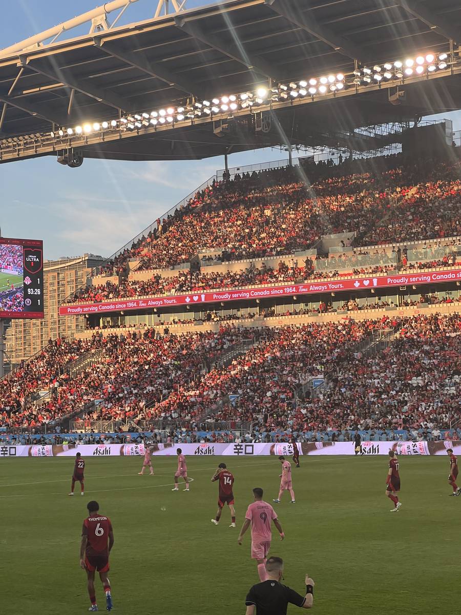 A packed BMO Field in golden evening light, 93rd minute on the scoreboard